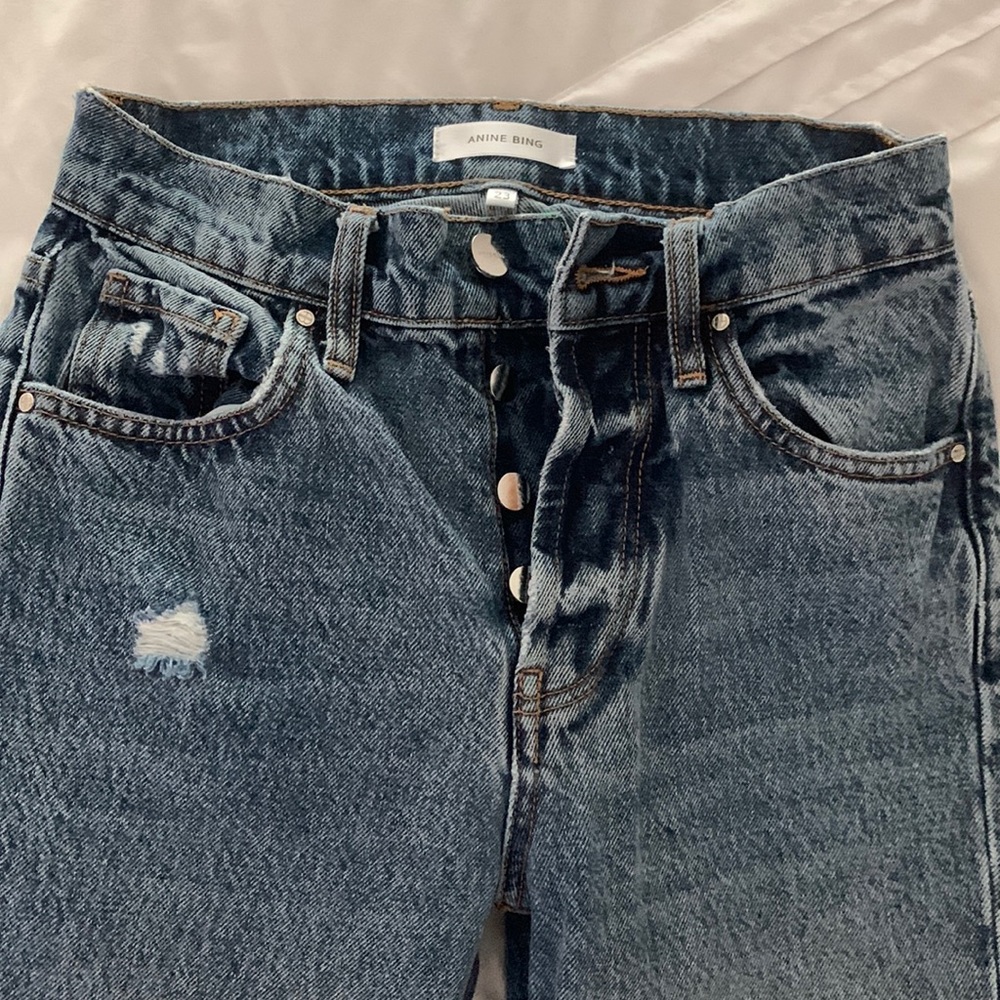 Annie Bing holes in knees boot/slight flare cropped jeans